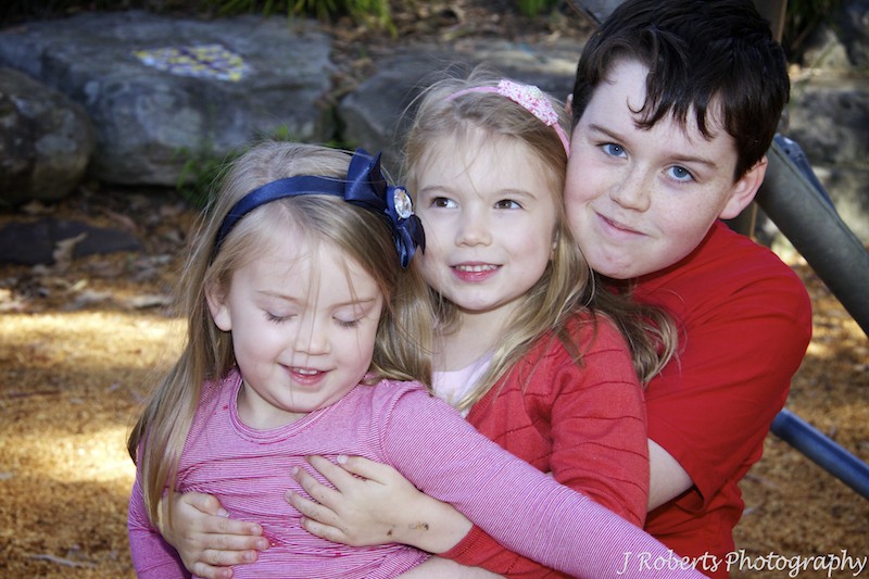 3 children hugging - family portrait photography